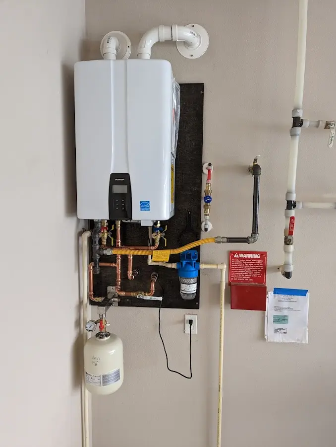 Professional plumber installing copper piping in a Lake Isabella home